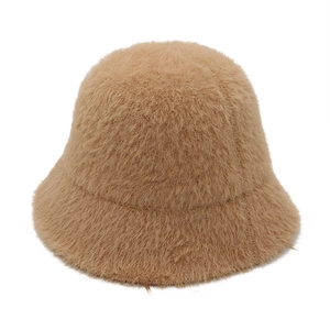 Detailed texture of camel faux mink fur on a soft winter bucket hat for women