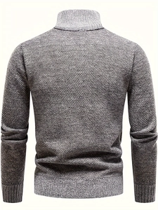 Detail view of men's knitted sweater showing thick gray melange texture and ribbed knit fabric