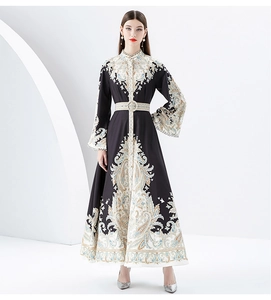 Detailed view of paisley print dress with flare sleeves and matching buckled belt