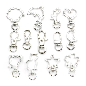 Silver metal lobster clasps in diverse cute shapes like shells hearts and cats for DIY crafts