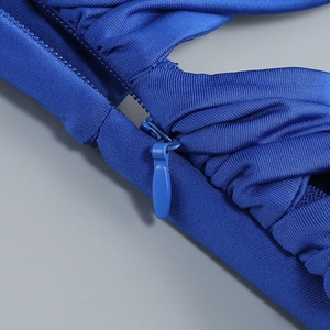 Close-up of royal blue knitted fabric featuring a seamless invisible zipper detail