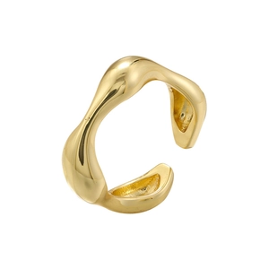 Macro view of polished gold irregular wavy open ring with mirror finish and liquid metal style