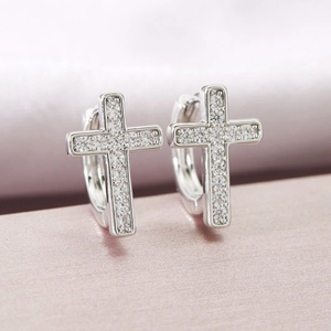 Exquisite silver cross hoop earrings with pave-set zircon on soft pink satin