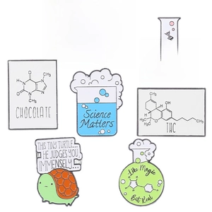 Collection of seven scientific enamel pins with chemistry flasks and science slogans