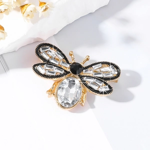 Exquisite gold honey bee brooch with crystal wings and black gemstone details