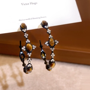 Vintage oval C-shaped earrings with tiger eye stone and crystals on black metal base