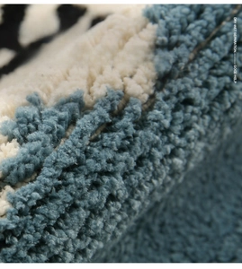Macro shot of thick blue and white fibers on a non-slip bathroom absorbent floor mat
