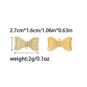 Golden stainless steel bow pendant with rhinestones showing front and back views with dimensions