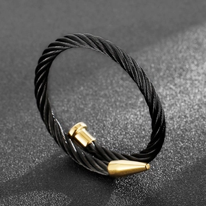 Men's steel cable open bracelet in black and gold finish with twisted wire texture