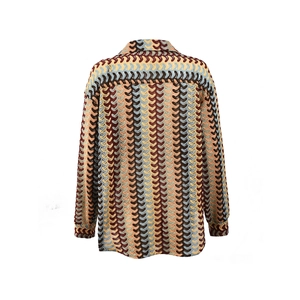 Detailed back view of vintage wavy knit long sleeve shirt in orange and brown tones
