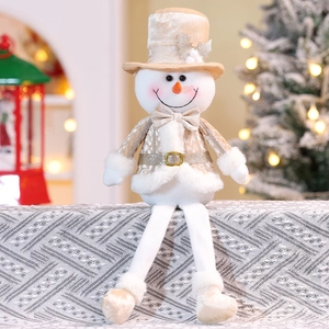 Detail of a Christmas snowman doll with long legs in champagne gold and white plush fabric