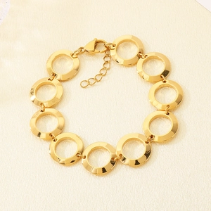 Close-up of 18K gold plated stainless steel interlocking circles bracelet with lobster clasp