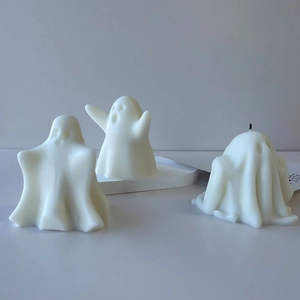 Three spooky white ghost-shaped Halloween scented candles for DIY home decor gifts