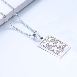 Detailed view of silver stainless steel Aries tarot card necklace pendant on O-chain