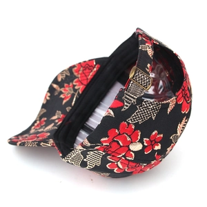 Detail of vintage graffiti cap with bronze metal buckle and floral tapestry pattern