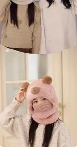 Detail of plush bear ear knit hat with integrated neck warmer for kids winter warmth