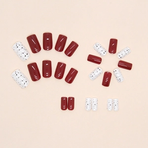 Glossy burgundy and speckled white square press-on nails with minimalist design
