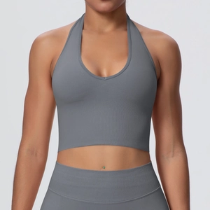 Detailed view of seamless grey halter neck sports bra with plunging V-neckline and wide hem