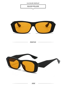 Detail view of retro polygon sunglasses with black frames and yellow tinted lenses