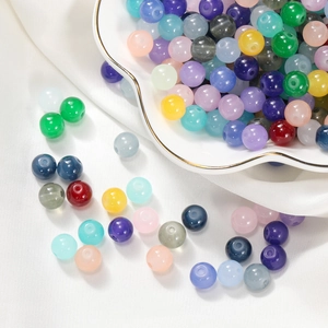 Mix of colorful candy-colored glass beads in various sizes for DIY jewelry making