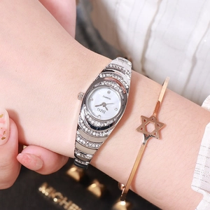 Silver ladies quartz watch with diamond bezel and oval dial on metal wristband