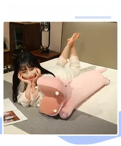 Pink cartoon hippo plush long pillow shown on bed for a cozy bedroom atmosphere