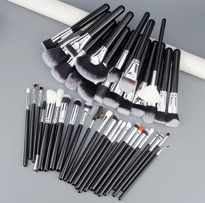 Close-up of 40-piece professional makeup brush set with soft bristles and black handles