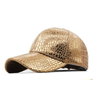 Metallic gold baseball cap with embossed crocodile texture and structured hard top design