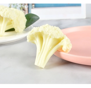 Macro shot of realistic PVC cauliflower model with natural green gradient and texture