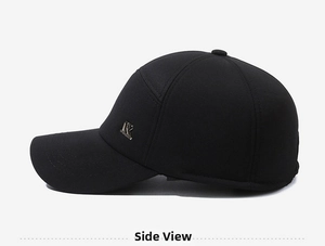 Detail view of winter baseball cap showing textured black fabric and silver metal R logo