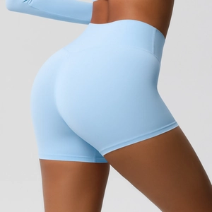 Side view detail of high-waisted light blue yoga shorts with body-shaping lift fit