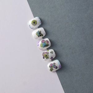 Detail of 5D embossed nail stickers featuring colorful hand-painted flowers and hearts