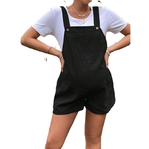 Detail of adjustable waist strap on black maternity overalls shorts with white t-shirt