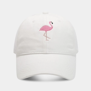 Close-up of pink flamingo embroidery detail on a white soft cotton baseball cap