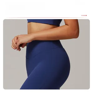 Close-up of side seams and butt-lifting texture on dark blue high-waisted yoga pants