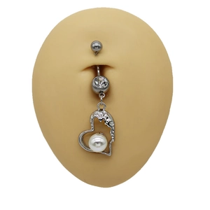 Detail of silver heart navel ring with white faux pearl and zircon on model