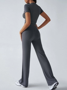 Rear view of a casual grey two-piece set featuring short-sleeve top and wide-leg pants