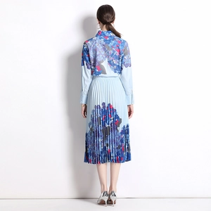 Blue hydrangea print polo shirt and pleated midi skirt set shown from the back