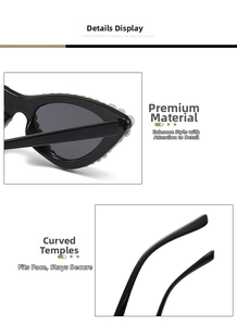 Detail of black cat-eye sunglasses featuring white faux pearl inlays on the frame edges