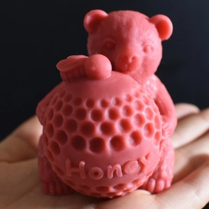 Detail of pink bear silicone mold with honey texture and engraved Honey text