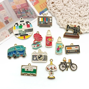 Macro view of vintage alloy charms featuring retro sewing machine and camera designs