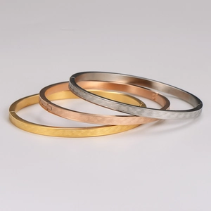 Three-piece stainless steel spiral bangles in gold, rose gold and silver finish