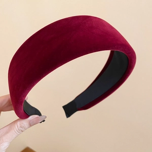 Close-up of deep red velvet padded headband showcasing thick texture and soft fabric