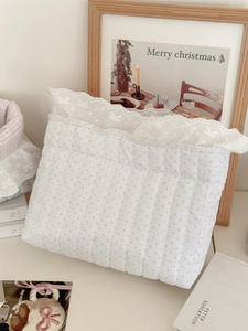 Quilted white storage basket with pink polka dots and elegant white lace trim detail