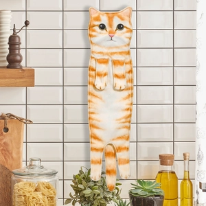 Detail of hanging orange tabby cat hand towel showing lifelike texture in kitchen