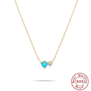 Detail of S925 sterling silver gold-plated necklace with turquoise and zircon pendant