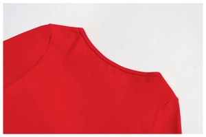 Detail shot of the red yoga suit's crew neckline and high-quality stitching work