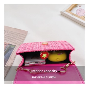 Interior view showing the capacity of pink tweed crossbody bag with magnetic buckle