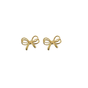 Minimalist gold bow-shaped stud earrings with polished metallic finish on white background