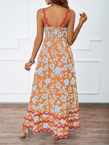 Back view of bohemian orange floral maxi dress with backless design and elastic waist